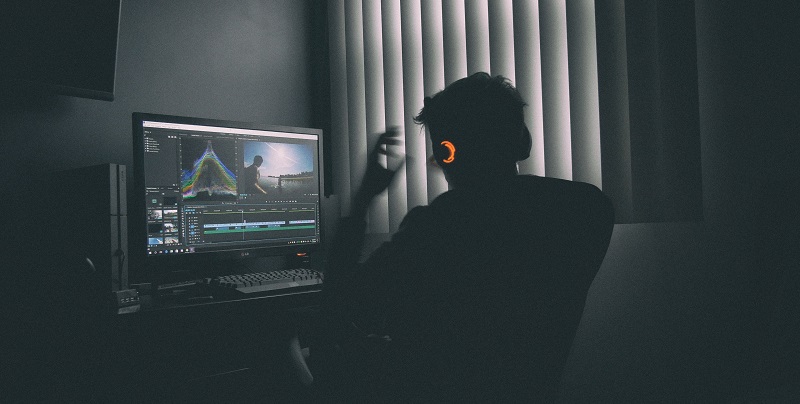 Designer at a computer desk.