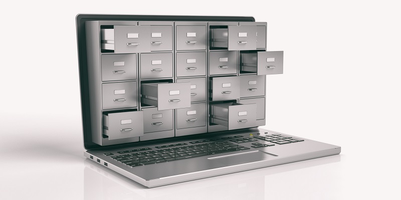 Ein Bild eines Laptops, aus dessen Bildschirm geöffnete Schubladen herausragen.