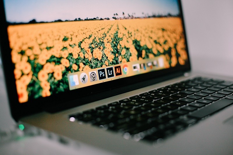 A laptop with flowers on the screen.