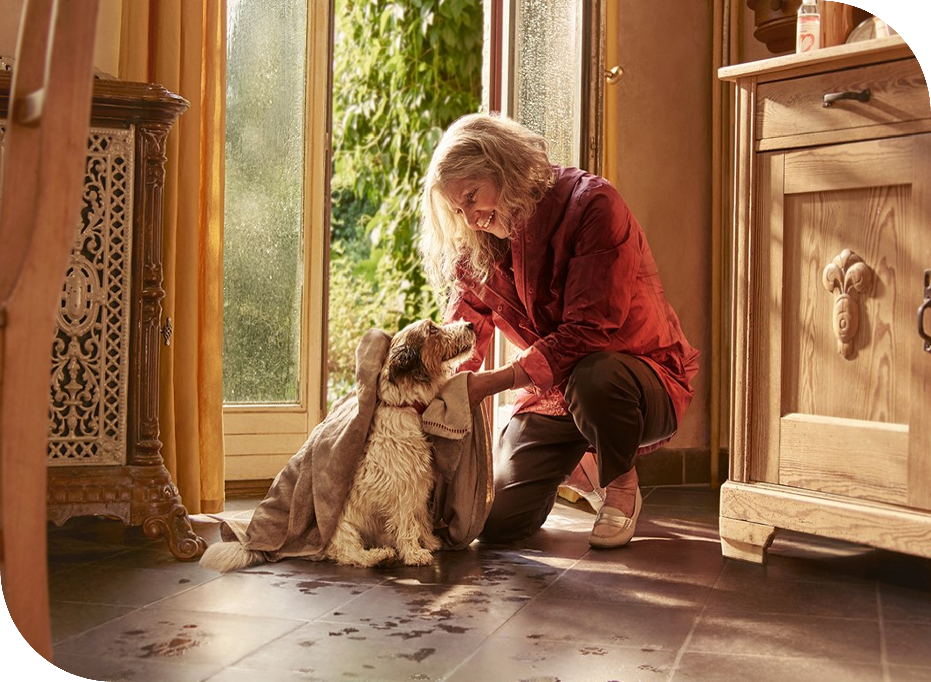 Woman and her dog in sunny room